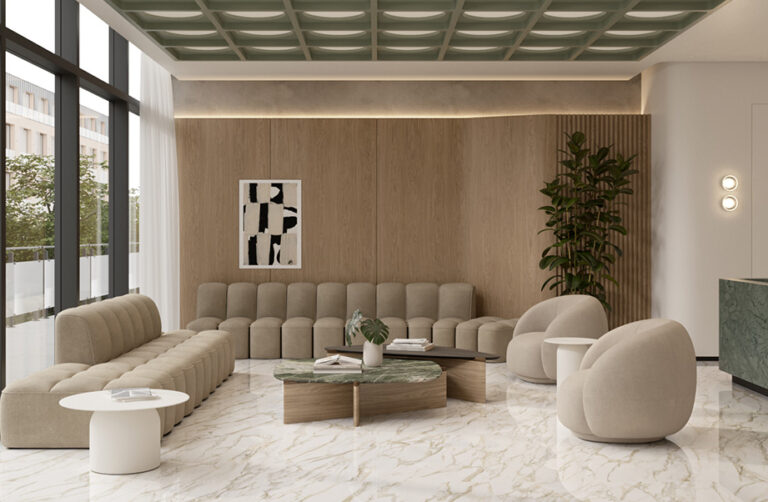 Sala de espera contemporánea con piso porcelánico efecto mármol de Interceramic, mobiliario neutro y grandes ventanales